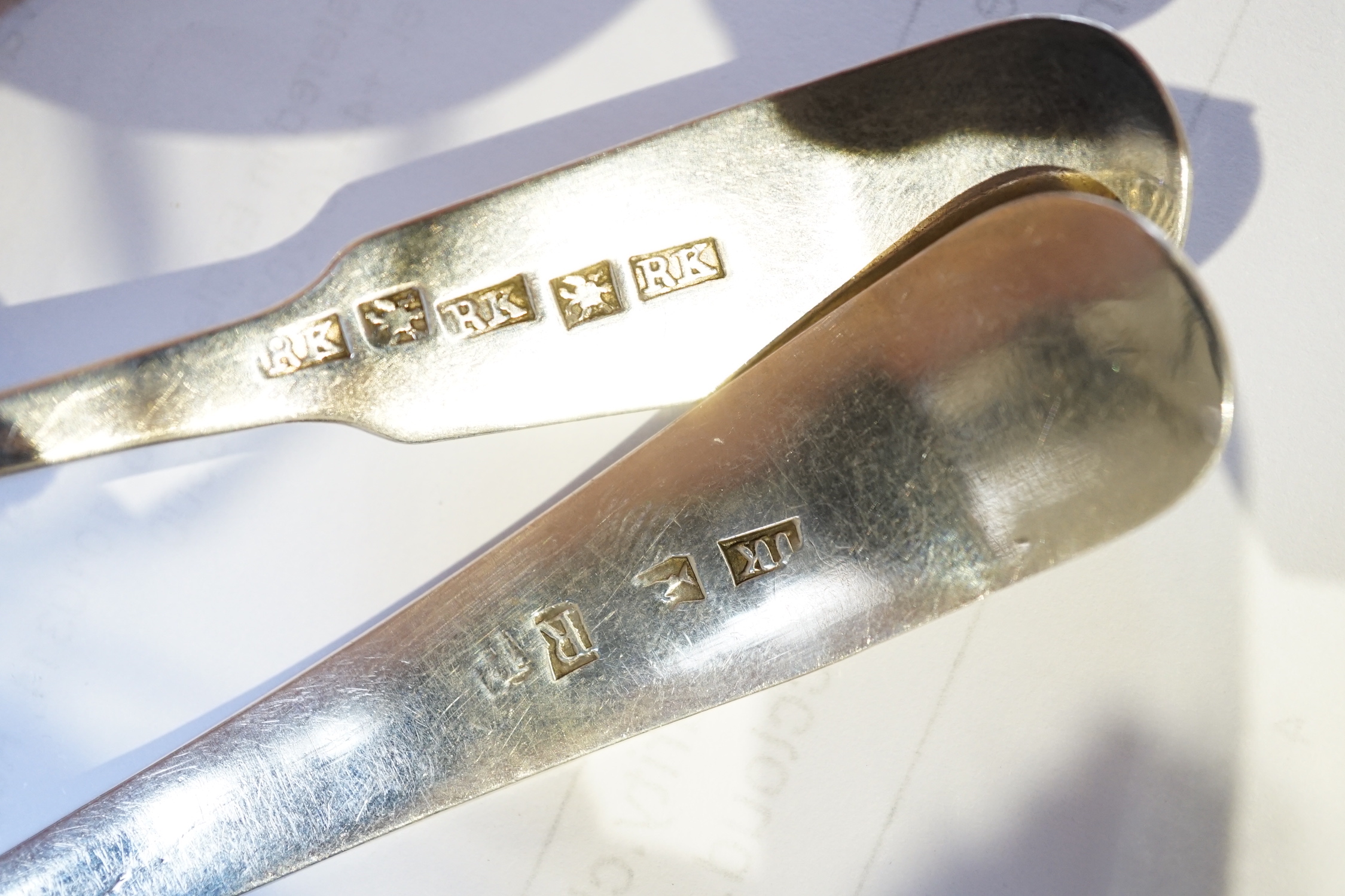 A set of three George III Scottish Provincial silver Old English shell pattern toddy ladles, by John Keith, Banff, circa 1795-1800, together with an early Victorian Scottish Provincial fiddle and shell pattern toddy ladl